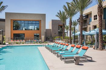 Relaxing resort-style pool with sundeck, spa, cabanas, and showers